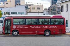 Fukuoka University Wakaba High School bus parked near Kamome Plaza in Chuo Ward