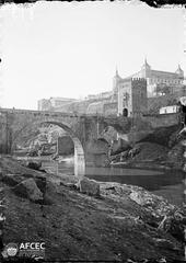 View of the fortified Alcántara Bridge over the Tagus River and part of the city of Toledo