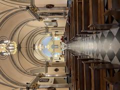 Interior view of Église de Saint-Dévote in Monaco showing detailed architecture and ornate altar