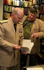 Adm. James Stavridis and J. N. Pritzker at NATO history photography exhibit in Pritzker Military Library Chicago