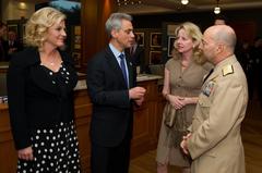 NATO dignitaries discussing before photography exhibition opening in Chicago