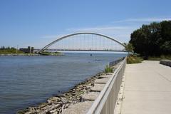 Mouth of the Humber River in Toronto flowing into Lake Ontario with pedestrian walkway and bridge