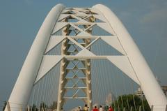 Humber Bay Arch Bridge over water under blue sky