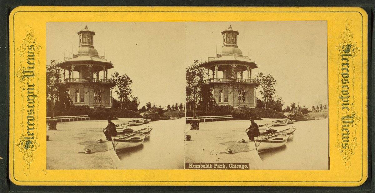 Black and white photograph of Humboldt Park in Chicago with people walking and trees in the background