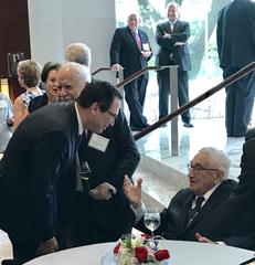 Former Secretary of State Henry Kissinger celebrating his 95th birthday with Steven Mnuchin