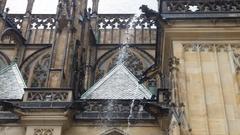 Spitting gargoyle statue on St. Vitus Cathedral at Prague Castle
