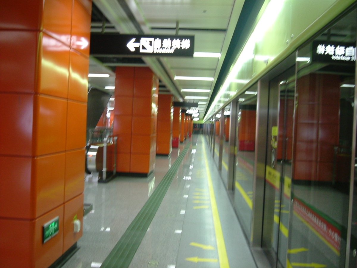 Shayuan Station GF line reservation platform with bustling commuters and modern railway infrastructure