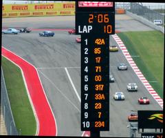 Vintage race cars lined up at the 2014 Circuit of the Americas event