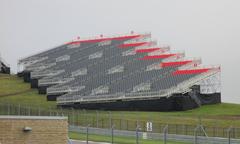 Vintage race cars lined up on the track at the 2014 Circuit of the Americas event