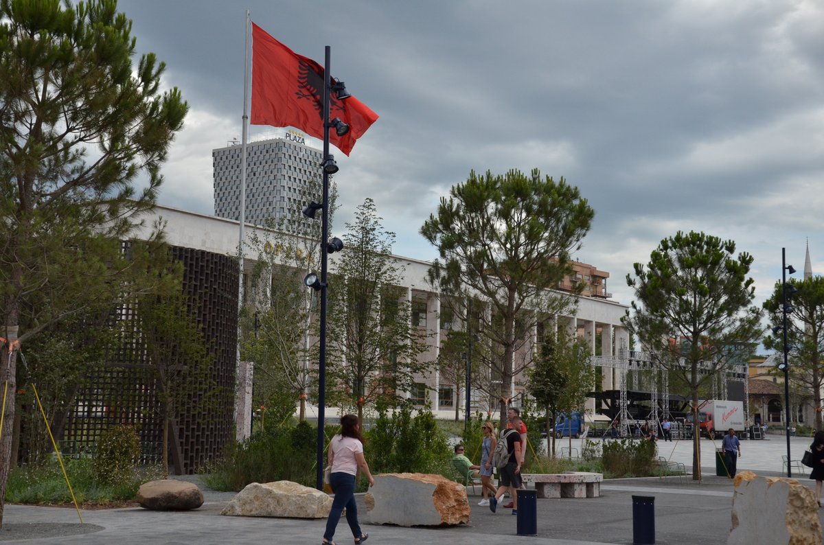 Cityscape of Tirana in July 2017 showing urban buildings and greenery