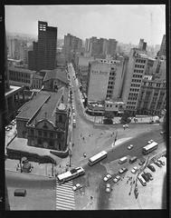 Historic view of Praça Clóvis in São Paulo before metro demolitions showing Church of Ordem Terceira do Carmo and Diário Popular building