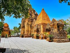 Historic Cham Hindu temples complex atop Mount Cù Lao in Nha Trang, Vietnam, featuring ancient brick towers dedicated to Ponagar (Uma), Shiva, Kartikeya, and Ganesha
