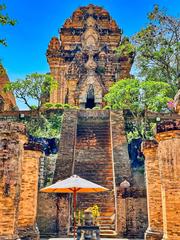 Cham-style Hindu temple tower with massive mandapa pillars and steep steps leading to Uma temple at Po Nagar Hindu temples complex in Nha Trang Vietnam
