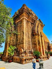 Historic Cham Hindu temples complex on Mount Cù Lao in Nha Trang, Vietnam, featuring the main Ponagar tower and surrounding temples under a clear blue sky