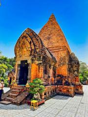 Ancient Cham Hindu temples complex at Po Nagar on Mount Cù Lao in Nha Trang, Vietnam under bright blue sky