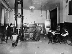 Early 20th century Drexel Machine Testing Laboratory with men operating large mechanical testing machines
