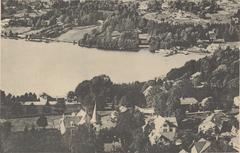 Postcard showing a siesta at Lake Gérardmer with calm water and surrounding trees