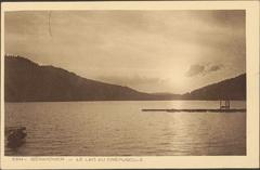 Lac de Gérardmer at dusk with calm water and fading light