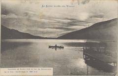 Sunset over Lake Gérardmer with colorful sky and calm water