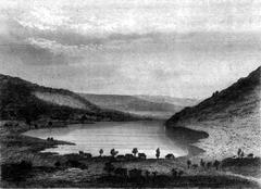 Scenic view of Lac de Gérardmer surrounded by forested hills