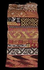 Chancay style ancient textile sampler with geometric patterns and intricate designs