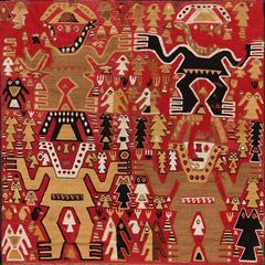 Chimú style ceremonial textile with intricate geometric and animal patterns in black and white