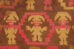 Detail of Chimú style mantle with intricate geometric patterns and textiles