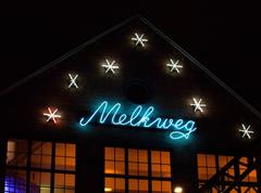 Neon sign of Melkweg in Amsterdam illuminated during evening program at GLAMcamp Amsterdam