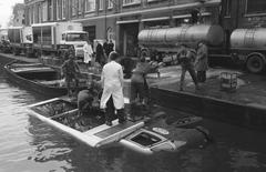 Milk delivery truck rolling off handbrake into the Lijnbaansgracht canal in black and white, Amsterdam 1961