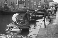 Milk delivery vehicle rolling off the handbrake on the Lijnbaansgracht canal in Amsterdam, black and white photo from 1961