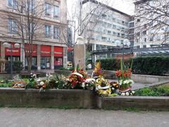 Memorial flowers on Rue Moncey in Lyon 3rd arrondissement in 2020, days after commemoration