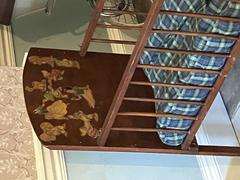 Baby's bed decorated with 1940s Disney stickers