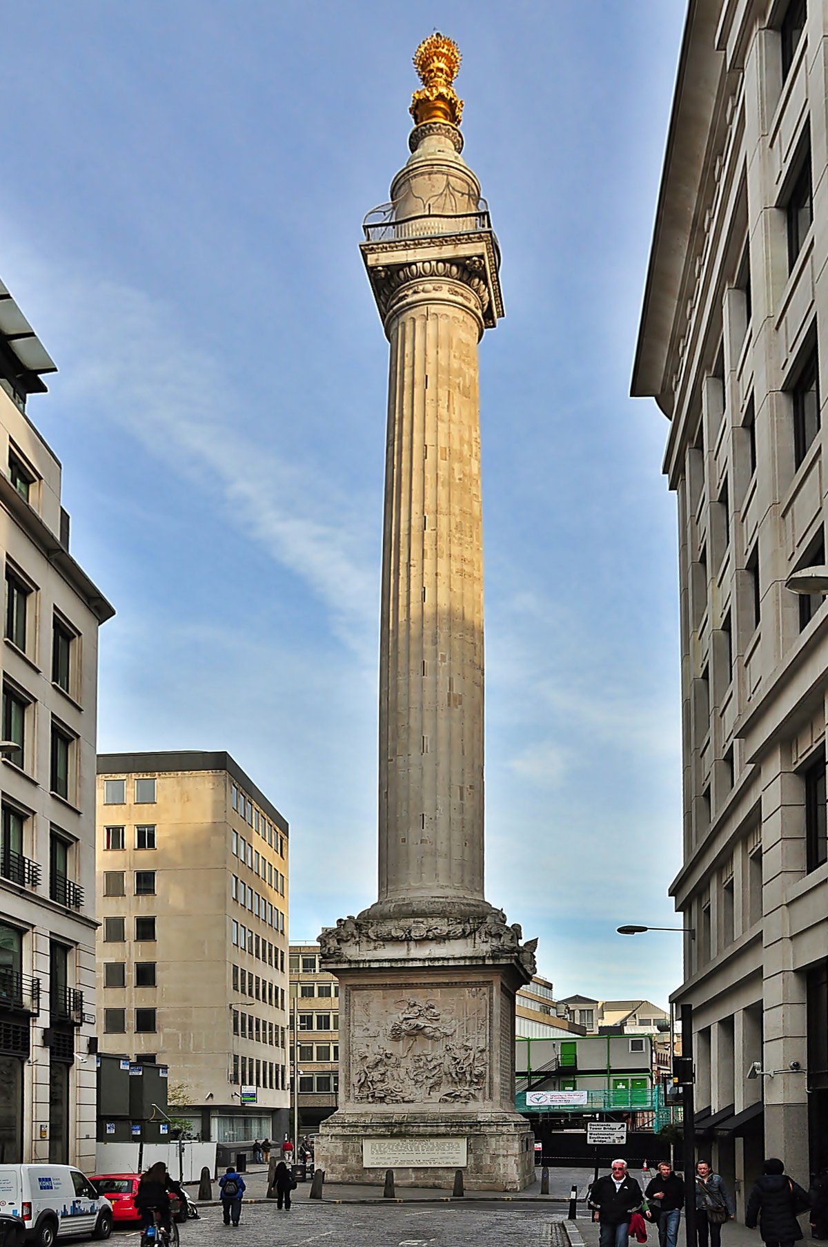 Monument to the Great Fire of London towering against a blue sky