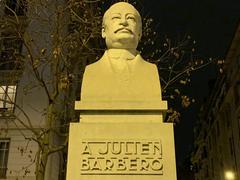 Monument to Julien Barbero in Lyon France large stone sculpture with a seated figure