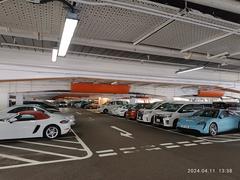 Indoor carpark at Harbour City Ocean Terminal in Tsim Sha Tsui Hong Kong with parked cars