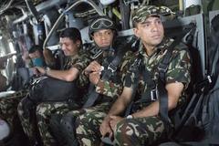 Nepalese service members looking out from a U.S Marine Corps MV-22 Osprey at Tribhuvan International Airport in Kathmandu, Nepal