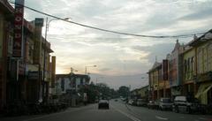 Downtown Masjid Tanah street scene with traditional buildings and shopfronts