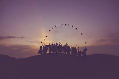 Graduates in Malacca celebrating with diploma folders