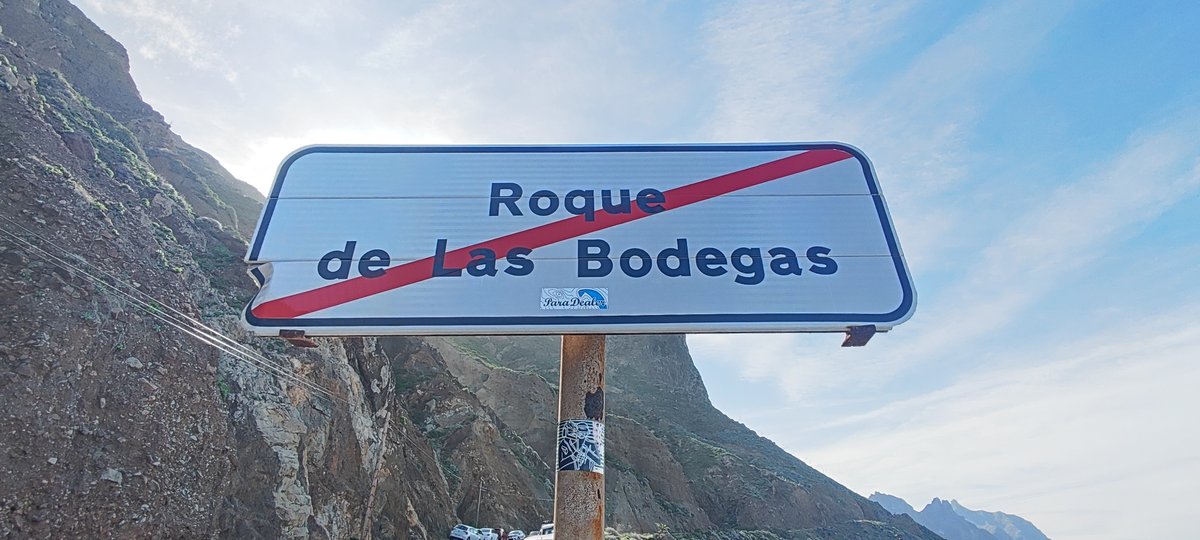 Exit sign at Roque de las Bodegas in natural rocky landscape
