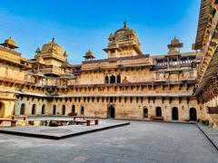 Jehangir Mahal palace in Orchha, Madhya Pradesh showcasing Indo-Islamic architectural fusion with colorful painted walls, ribbed dome and chhatris