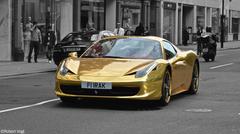 Golden Ferrari 458 Spider parked on Sloane Street in London