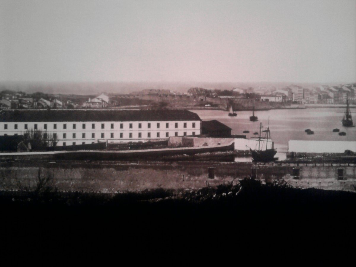 Historic La Coruña tobacco factory building with the now non-existent bastions and wall of Pescadería in the background