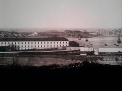 Historic La Coruña tobacco factory building with the now non-existent bastions and wall of Pescadería in the background