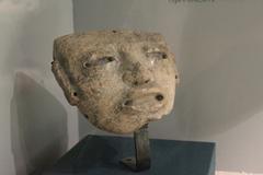 Museum site at Teotihuacan with outdoor stone structures and sculptures