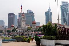 Sultan Abdul Samad Building in Kuala Lumpur with its distinctive clock tower under a clear sky