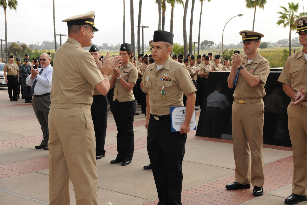 Hospitalman Ernest M. Jimenez receiving Navy and Marine Corps Commendation Medal with Combat Distinguishing Device at Naval Medical Center San Diego