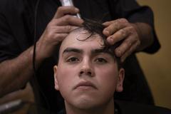 New recruit receiving initial haircut at Marine Corps Recruit Depot San Diego