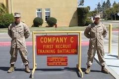 Two Marine recruits, Pvt. Christian Miervalle and Pvt. Jesus Mier, in uniform at graduation from recruit training at Marine Corps Recruit Depot San Diego