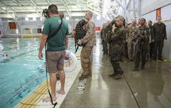 Recruits of Lima Company performing 25-meter swim with waterproof packs during Water Survival Basic Qualification at Marine Corps Recruit Depot San Diego