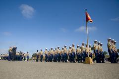 Secretary of Defense Robert M. Gates saluting newly enlisted Marines during graduation ceremony at Marine Corps Recruit Depot San Diego